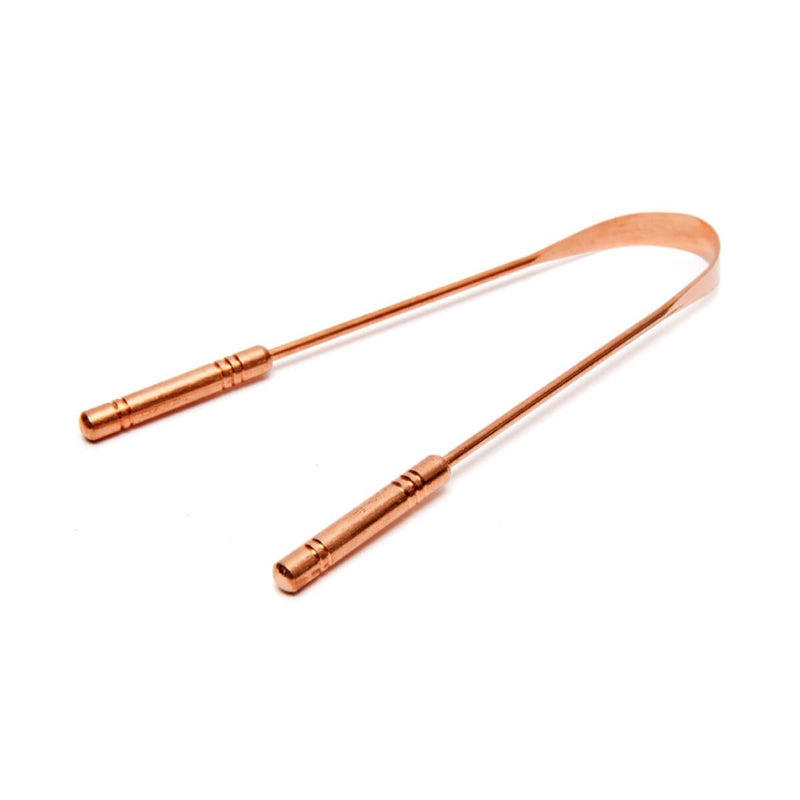 Copper tongue scraper on white background